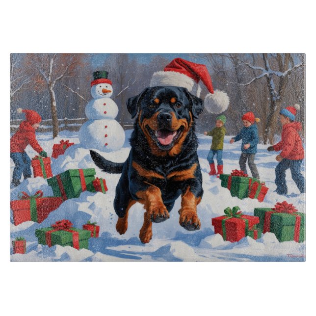 Rottweiler läuft im Schnee mit Weihnachtshut Schneidebrett (Vorderseite)