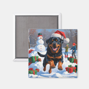 Rottweiler läuft im Schnee mit Weihnachtsmütze Magnet