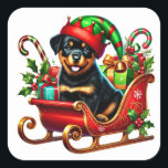 Rottweiler, Weihnachtsgeschenk Sleigh Quadratischer Aufkleber<br><div class="desc">Ein fröhlicher Rottweiler-Welpe mit einem spielerischen Elf,  der in einem farbenfrohen Schlitten mit Weihnachtsgeschenken sitzt. Umgeben von lebendigen Feriendekorationen wie Bonbons und Heiligen,  spiegelt diese fröhliche Szene den Geist der Festsaison wider.</div>