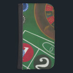 Roulettetisch mit Chips und Rädern Phone Geldbeutel<br><div class="desc">Das Spinnrad hält den ganzen Power auf dem Roulettetisch,  aber der Power dieses Gemäldes liegt in der lebensechten Darstellung einer Casinoszene. Das Grün des Filzes und die Farbe der Chips bringt Sie am Tisch,  wartend auf Ihrem Einsatz,  um sich auszuzahlen. Kaufen Sie Ihr Exemplar dieses phantastischen Drucks noch heute!</div>