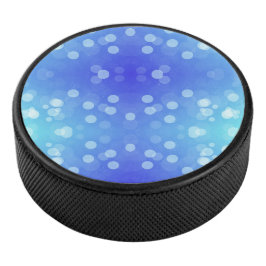 Round blue Bluetooth speaker with a front design Eishockey Puck