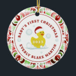 Rubber Duck Baby's First Christmas Foto Keramik Ornament<br><div class="desc">Illustration eines Spielzeugs aus gelber Gummiente,  das eine Weihnachtsmannmütze trägt,  umgeben von Bläschen mit roter und grüner Wasserfarbe und rotem Text. Personalisieren Sie Ihre persönlichen Daten mit dem Namen und dem Jahr des Babys. Personalisieren Sie das Foto auf der Rückseite.</div>