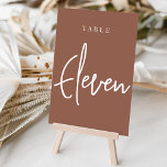 Rust Hand Scripted Table ELEVEN Tischnummer<br><div class="desc">Einfache und schicke Tischnummer-Karten im Erdton Rost braun und Weiß machen eine elegante Aussage bei Ihrer Hochzeit oder Veranstaltung. Das Design bietet "table [number]" in einem spannenden Mix aus klassischen Serifen und handgeschriebenen Skripten. Design wiederholt sich auf beiden Seiten. Einzelne nummerierte Karten werden separat verkauft; bestellen Sie jede Tischnummer einzeln...</div>