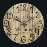 Rustic Personalized Brown Wood Custom Große Wanduhr<br><div class="desc">Beautiful, einzigartig, one-of-a-kind personalized design feature a-rustic brown wood with black personalization his and her names in a script machen overlay design and the last name and year establishd in a bold script with a printed wood background. Personalize this clock by adding your personal information. Makes a great wedding, anniversary,...</div>