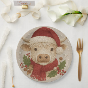 Rustikale Hochlandkuh mit Weihnachtsmannmütze Pappteller