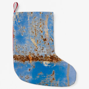 Rusty Metallstruktur, blau gekratzte Dekoration. Kleiner Weihnachtsstrumpf