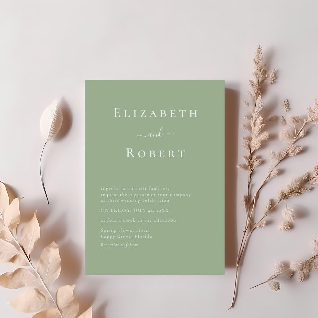 Sage Green Modern Minimalist Script Wedding Einladung (Sage Green Modern Minimalist Script Wedding Invitation on a table with blush pink flowers.)