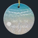Sand Is The New Snow Beach Christmas Ornament<br><div class="desc">This fun beach living design Sand is the new snow ornament feature a beach scene with a seashell and string lights handing across the top. Personalize by adding a year.</div>