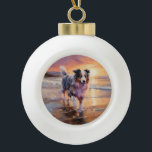 Sandy Australian Shepherd Dog on Beach Sunset Keramik Kugel-Ornament<br><div class="desc">Tauchen Sie ein in die ruhige Schönheit unseres Hundes "Sandy Paws and Sunset Hues" mit Sonnenuntergang am Strand. Diese faszinierende Szene vereint das Wesen eines perfekten Abends am Ufer, mit einem treuen Hund, der den goldenen Sand und die atemberaubenden Farben der untergehenden Sonne genießt. Ob Hundeliebhaber oder Sonnenuntergang - dieses...</div>