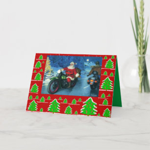 Sankt auf einem Motorrad/chrstmas Bäumen Feiertagskarte