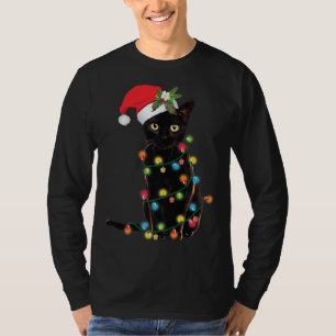 Santa Black Cat hallte in Weihnachtsbaumlicht auf T-Shirt
