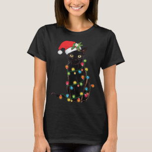 Santa Black Cat hallte in Weihnachtsbaumlicht auf T-Shirt