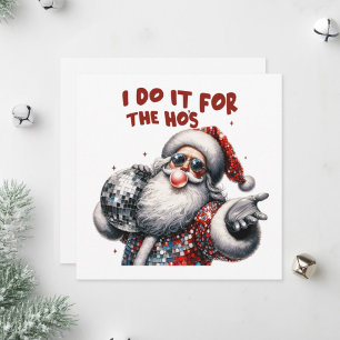 Santa Claus hält eine funkelnde Disco-Kugel.  Feiertagskarte