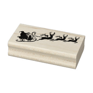 Santa Claus mit seinem Schlitten und Rentieren Gummistempel