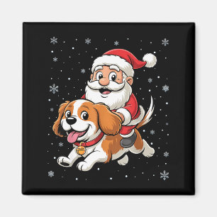 Santa Claus reitet auf einem Cavalier King Charles Magnet