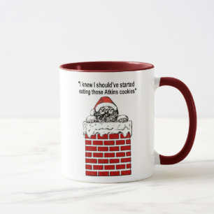Santa klebt in einer Tasse