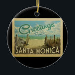 Santa Monica Beach Vintage Keramik Ornament<br><div class="desc">Diese Grüße aus Santa Monica Vintage Postkarte Design verfügt über einen Sandstrand mit einem schönen türkisfarbenen Meer Wasser und über dem Meer,  einen blauen Himmel mit billigen weißen Wolken. Im Vintage Reisen Stil.</div>