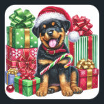 Santa Paws: Candy Cane Bandit! Quadratischer Aufkleber<br><div class="desc">Machen Sie sich bereit für einen poppigen Urlaub Spaß! Dieser bezaubernde Rottweiler-Welpe rockt eine festliche Weihnachtsmannmütze und ist umgeben von farbenfrohen, bandförmigen Geschenken, die Weihnachtsmagie schreien. Mit einem großen, fröhlichen Zungengrin und einem Bonbonbon in Pfote ist dieses spielerische Jungtier der perfekte Urlaubsfreund für Kinder, die Liebe und Weihnachten jubeln! Helle...</div>