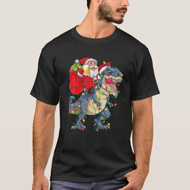Santa Riding a Dinosaur Weihnachtsbaum T Rex Drink T-Shirt (Vorderseite)