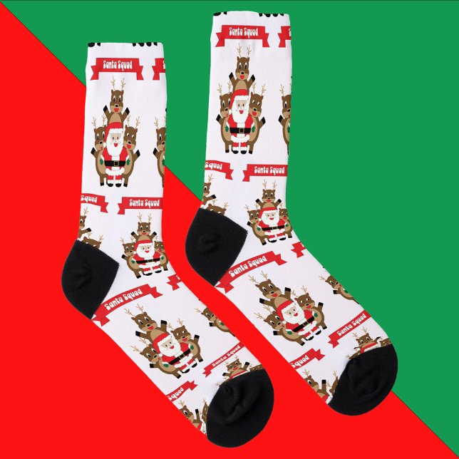 Santa Squad Reindeer Funny Pattern Socken (A pair of socks with a pattern of santa and reindeer with a banner that reads Santa Squad.)