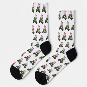 Santa und Frau Claus fahren mit einem Roller Socken