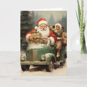 Santa und Kind in einem kleinen grünen Auto mit Ge Karte