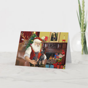 Santas zwei Zwergpinscher. Feiertagskarte
