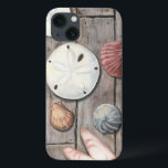 Schätze an der Küste iPhone 13 Hülle<br><div class="desc">Megan Meagher ist bekannt für ihre einfachen Kunstwerke. Dieses Bild zeigt die Einfachheit der Schätze der Küste, einschließlich Sand Dollars und Muscheln in einem pastellfarbenen Ton. Meagher umschließt einen hölzernen Hintergrund in ihrem Bild, um diese Schätze zu kontrastieren. Holen Sie sich diesen Kunstdruck heute auf Holzfarbe auf Ihrem Zazzle-Produkt.</div>