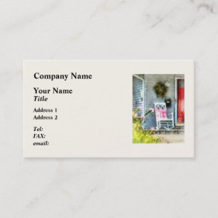 Schaukelstuhl mit rosa Kissen Visitenkarte