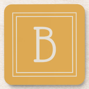 Schickes, monogrammiertes golden-gelbes und cremew getränkeuntersetzer