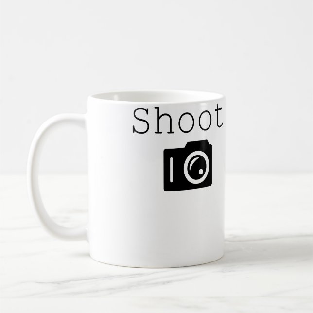 Schießen. Fotografie Fotograf mit Kamera Kaffeetasse (Links)