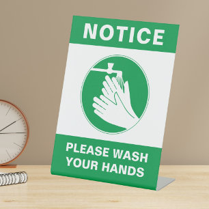 Schild für Handwäsche-Sicherheit auf der Tischplat