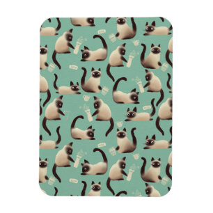 Schlechte siamesische Katzen klopfen über Magnet