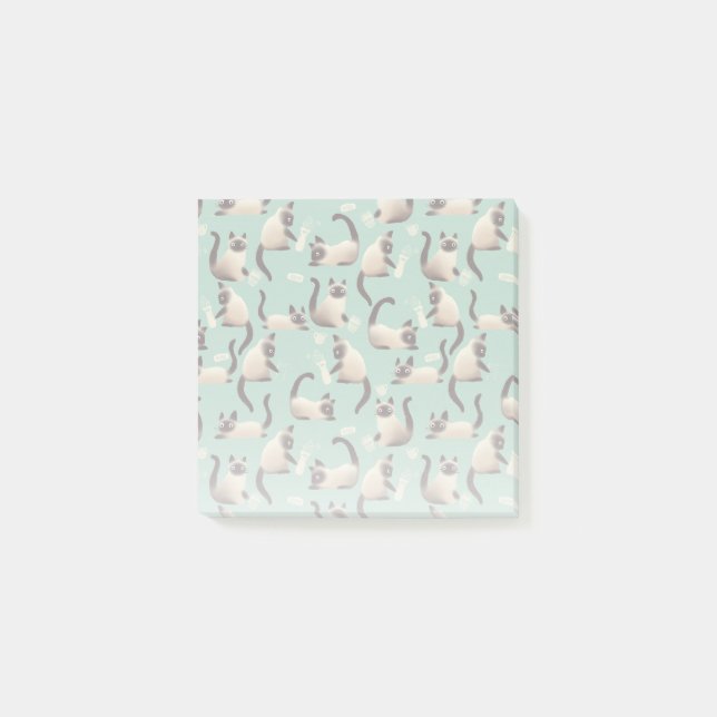 Schlechte siamesische Katzen klopfen über Post-it Klebezettel (Vorderseite)