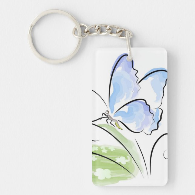 Schmetterling, der auf Gras über Blumenfeld sitzt Schlüsselanhänger (Vorderseite)