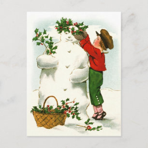 Schmücken des Schneemanns Feiertagspostkarte