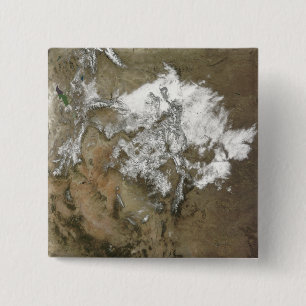 Schneabdeckungen die felsigen Berge in vereinigtem Button