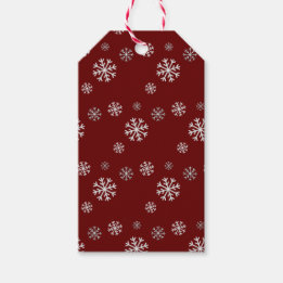 Schneefall auf rotem Weihnachtsgeschenkanhänger Geschenkanhänger