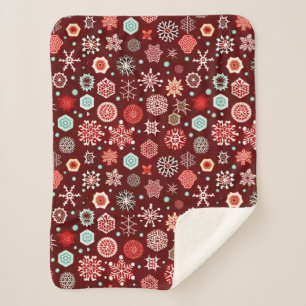 Schneeflocken auf Burgunderrot Sherpadecke