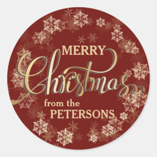Schneeflocken auf Red Gold Letter Frohe Weihnachte Runder Aufkleber