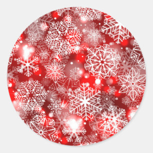 Schneeflocken auf Rot Runder Aufkleber