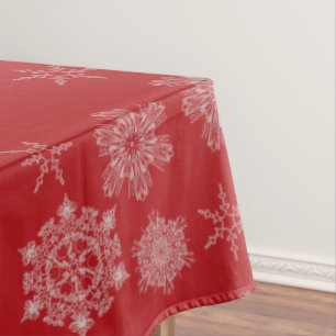 Schneeflocken auf rotem Hintergrund Tischdecke