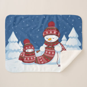 Schneemann strickt Weihnachtsschal Sherpadecke