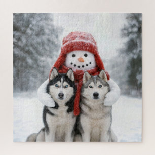 Schneemann umarmt sibirische Huskies Puzzle