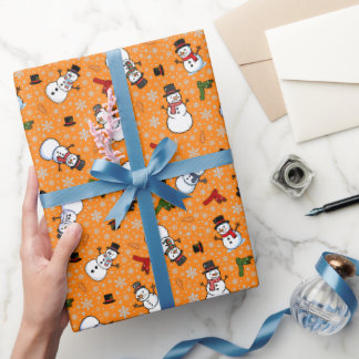 Schneemänner und Schneeflocken auf Orange Geschenkpapier