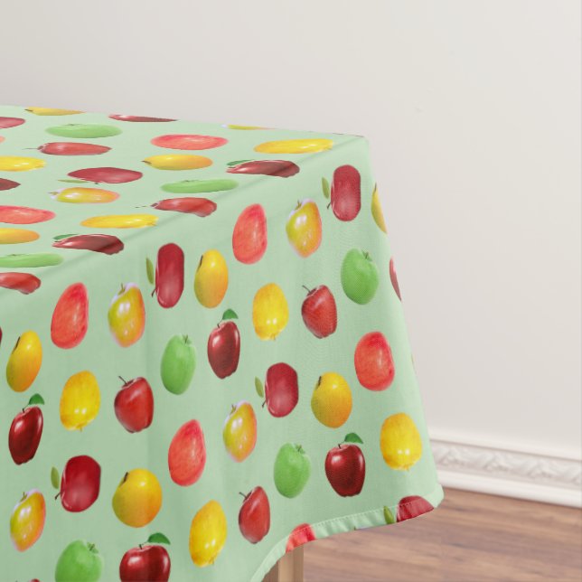 Schöne, natürliche, farbenfrohe Äpfel auf hellgrün Tischdecke (Beispiel)