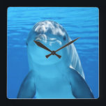 Schöner Delphin Quadratische Wanduhr<br><div class="desc">Eine wunderschöne Delfinuxe-Uhr,  die sich perfekt für einen Ozean- oder Strandbereich eignet. Die Uhr.</div>