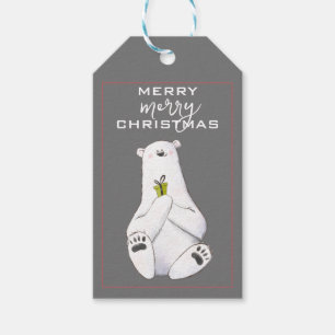 Schöner weißer Polar-Bär mit einem kleinen grünen Geschenkanhänger