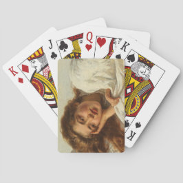 Schönes Mädchen liegt im Bett mit rotem Haar Spielkarten