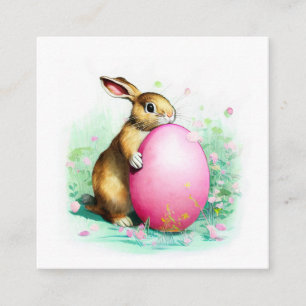 schüchternes Hase hinter einem großen Ostereier Begleitkarte